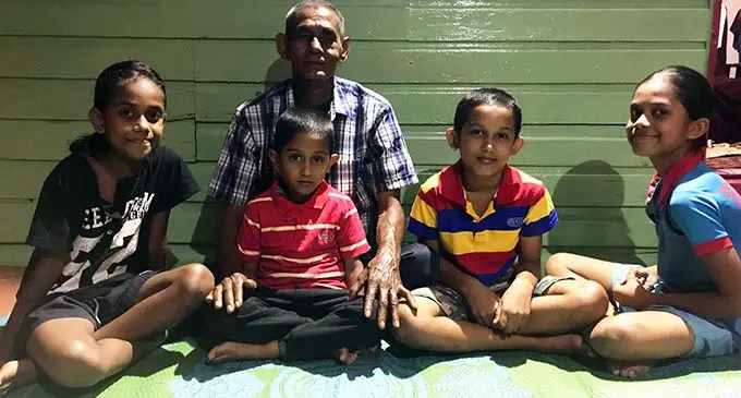 President of Vunivau Cemetery Feeder Road, Amvika Prasad with his grandchildren at their home in Vunika, Labasa, on November 6, 2019.   Photo: Laisa Lui