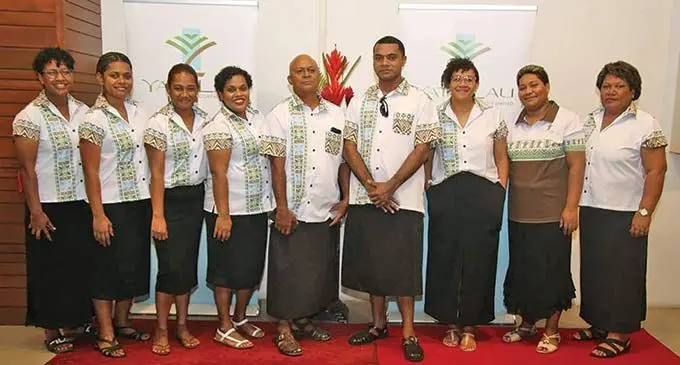 Staff of  Yatu Lau Company  Limited with their new uniforms that features the new company logo. 