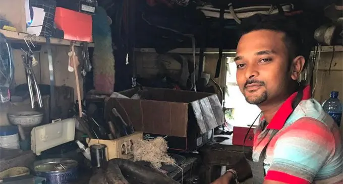 Ashwin Narayan in his little workshop in Rakiraki repairing a horse collar.  Photo: Ministry of Industry, Trade and Tourism
