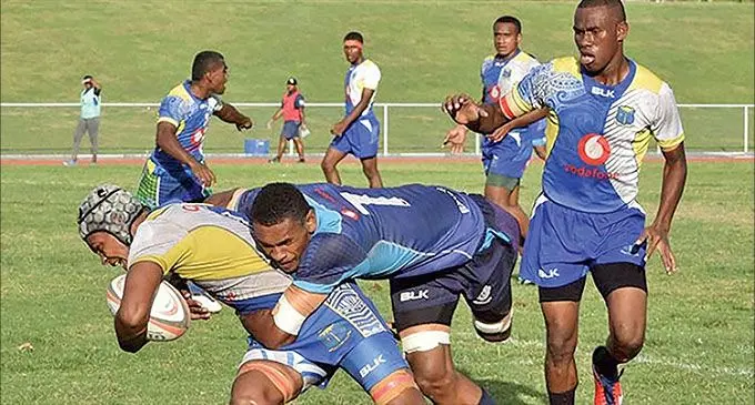 Natabua High School’s Epeli Drau is tackled by a Ratu Navula College player during the Under-18 semi-final of the Western Secondary School’s Championship at Churchill Park in Lautoka on July 13, 2019.