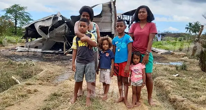 Leilani Baletalei with (from left), her son Pio Sake with nephews George Lala, Paulo Lala, and nieces little Faith Lala and Mere Semisi in Waila, Nausori. Behind them are the remains of their home which was destroyed by a fire on January 4, 2020. Photo: Shalveen Chand