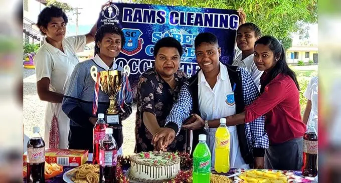 From left: Ateca Botitu, Kelera Bainiwaqa, College head Shelly Imran, highest goal scorer Sereana Saukuru, Toni Mari and coach Jackline Rani celebrating on September 10, 2022. Photo: Waisea Nasokia