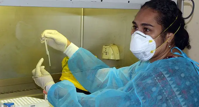 Ministry of Health lab technician Josephine Sassen carries out a COVID 19 sample test in a bio safety cabinet at Fiji Centre for Communicable Disease Control, Molecular Laboratory, in Tamavua, on May 18, 2020. Photo: Ronald Kumar  