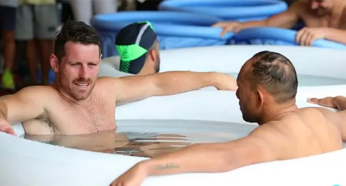 Bernard Foley and Christian Lealiifano of Australia sit in an ice bath in Odawara