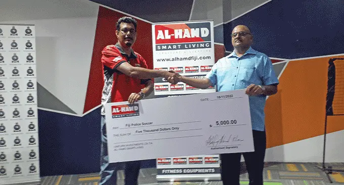 Al Hamd Smart Living managing director Ashfaaq Khan (left) hands over the cheque to Fiji Police Force’s SP Nilesh Lakhan at the Al-Hamd Smart Living Store in Suva, on November 16, 2022. Photo: Sereana Salalo.