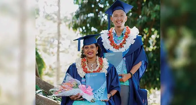 Eleni Tabua and Gerard Young with their degrees on December 14, 2023.
