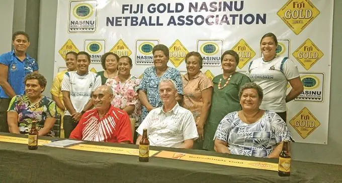 Fiji Gold Nasinu Netball Association president Linieta Nanovu (sitting- left), Paradise Beverages general manager sales and corporate affairs Joe Rodan (Snr), Paradise Beverage general manager  Michael Spencer with NNA officials and players in Suva on March 3, 2021. Photo: Simione Haravanua 