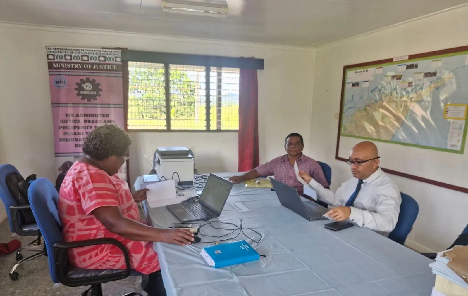 Ministry of Justice staff Michael Deve (right) with Vilisi Lauta assisting Suresh Chand in Wainikoro on May 13, 2026.