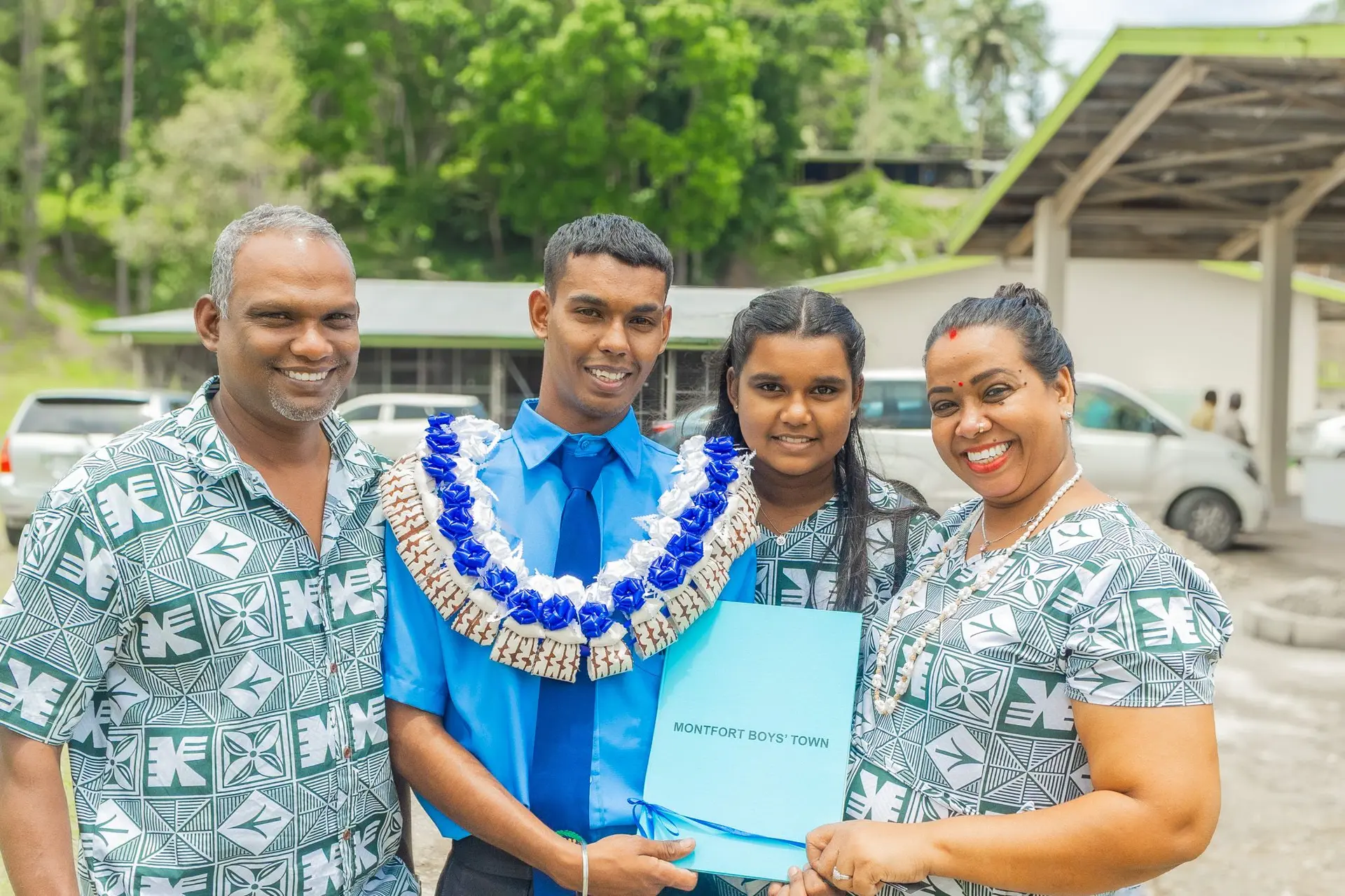From left: Ram Chand (father), graduate Kartik Ram, his sister Kaminianta Ram, and their mother Joyti Ram after the Montfort Boys Town graduation in Veisari on November 22, 2025.