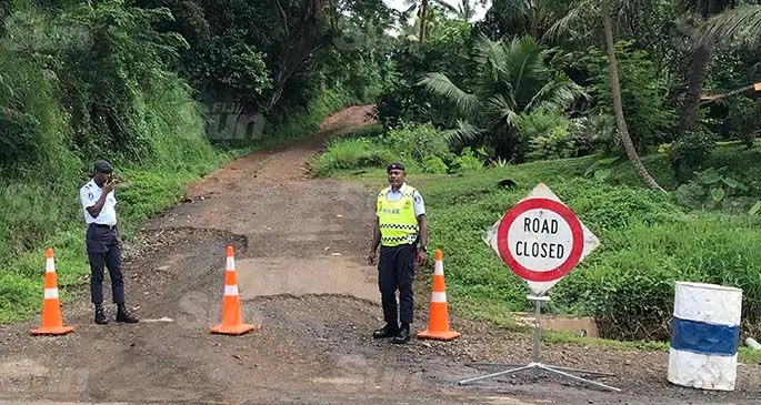 Police officers manning a closed road at Soasoa settlement in Labasa. Photo: Laisa Kabulevu