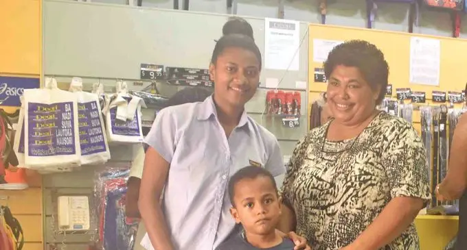 Emele Balekia (Sale girl at Deoji), Makelesi Sotikau and son Jone Nasoli at Deoji Store in Nadi on January 8, 2019. Photo: Mereleki Nai