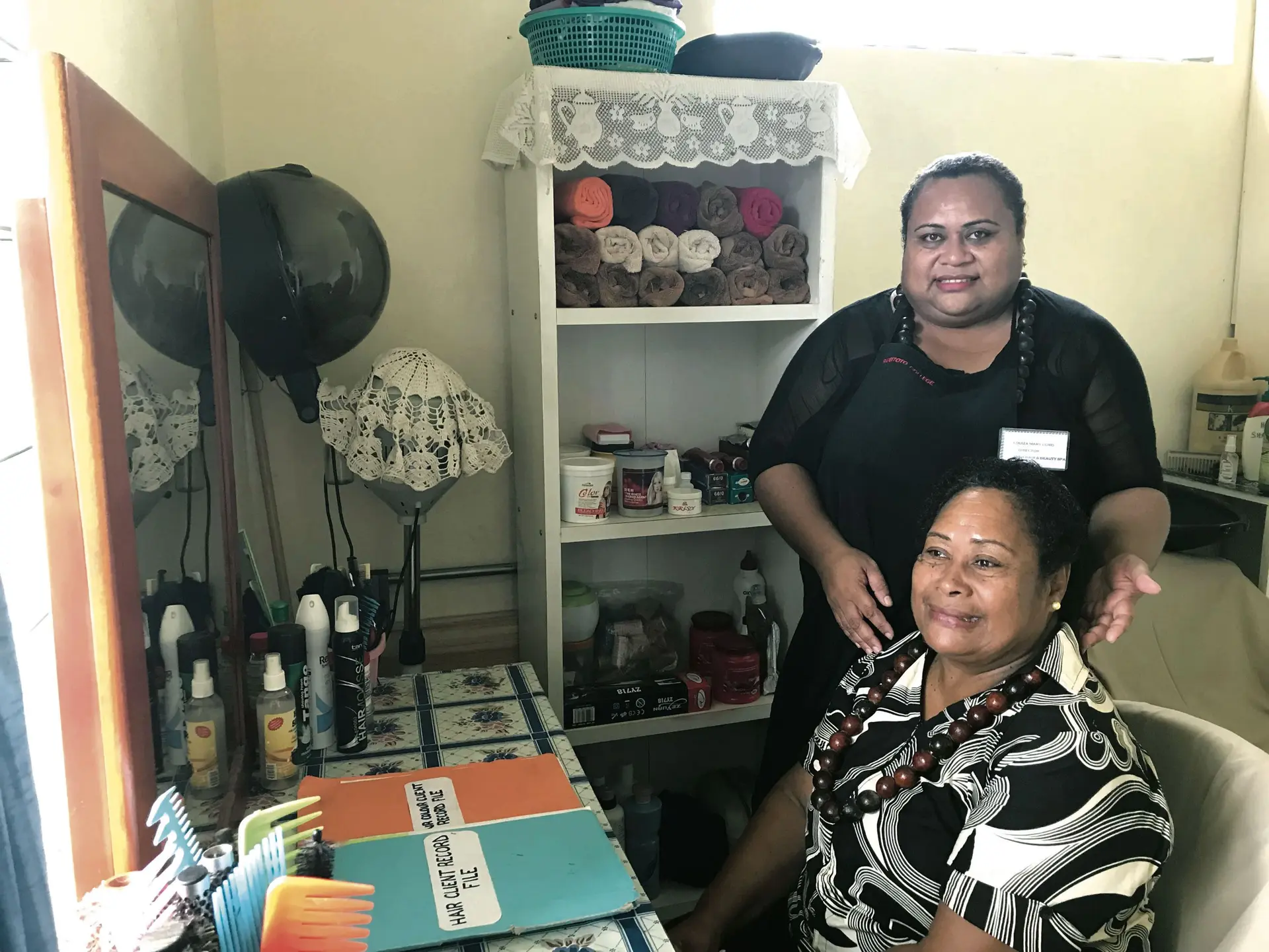 Louisa May Lord (standing), tending to a client at her salon in Rakiraki on February 3, 2018. Photo: Lusi Banuve