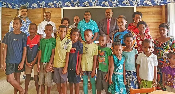 Acting Prime Minister and Minister for Agriculture and Rural Maritime Development, Mahendra Reddy with Biaugunu villagers at the newly commissioned village kindergarten on December 13, 2019.