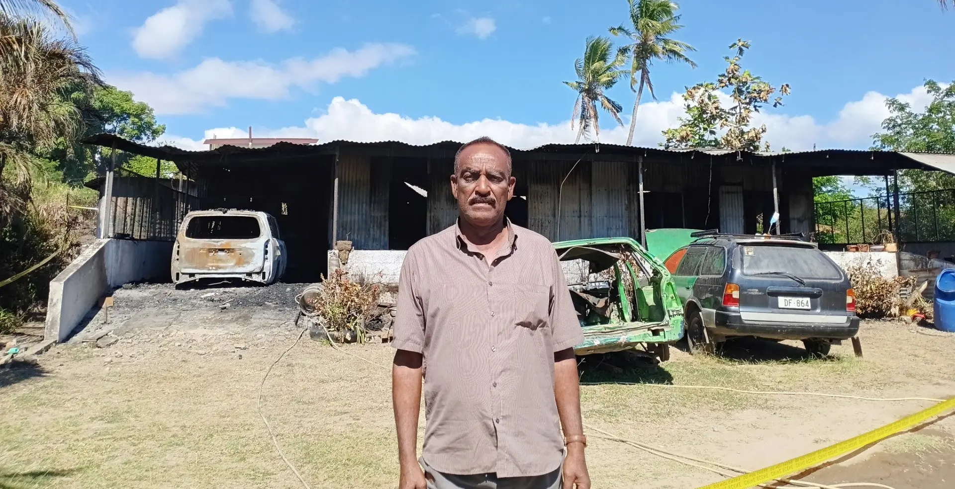 Vijendra Prasad in front of what remains of the home that was destroyed by fire on  Viseisei Bypass Road in Lautoka on July 13, 2026.