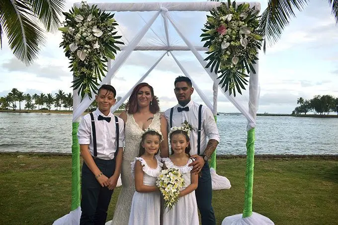 Newlyweds Cary Davis and Wade Davis with their children, Teylon, 12 (first from left) and the twins, Arlen, 7 (left) and Tiehn, at the Naviti Resort in the Coral Coast on June 13, 2022. Photo: Nicolette Chambers