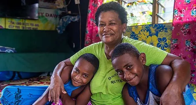 Grandmother Susana Saurara flanked with her grandson’s Peni Makuaki (left), and Usaia Koroibasaga, 13, at their home at Nanuku, Vatuwaqa on January 9. 2024 after receiving their $200 governments assistance. Photo: Leon Lord