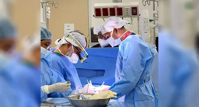 Surgeons and support medical professionals from the Sanjeevani Hospital who were brought in by the Sai Prema Foundation performing open heart surgery.