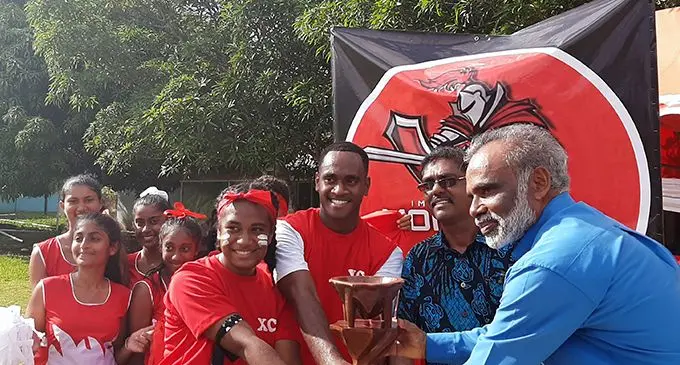  Monfort House captain Viliame Vakatalesau, centre, accepts the overall award from Xavier College manager Brother Francis after  the  inter-house competition in Ba on February 14,2020 Photo: Salote Qalubau