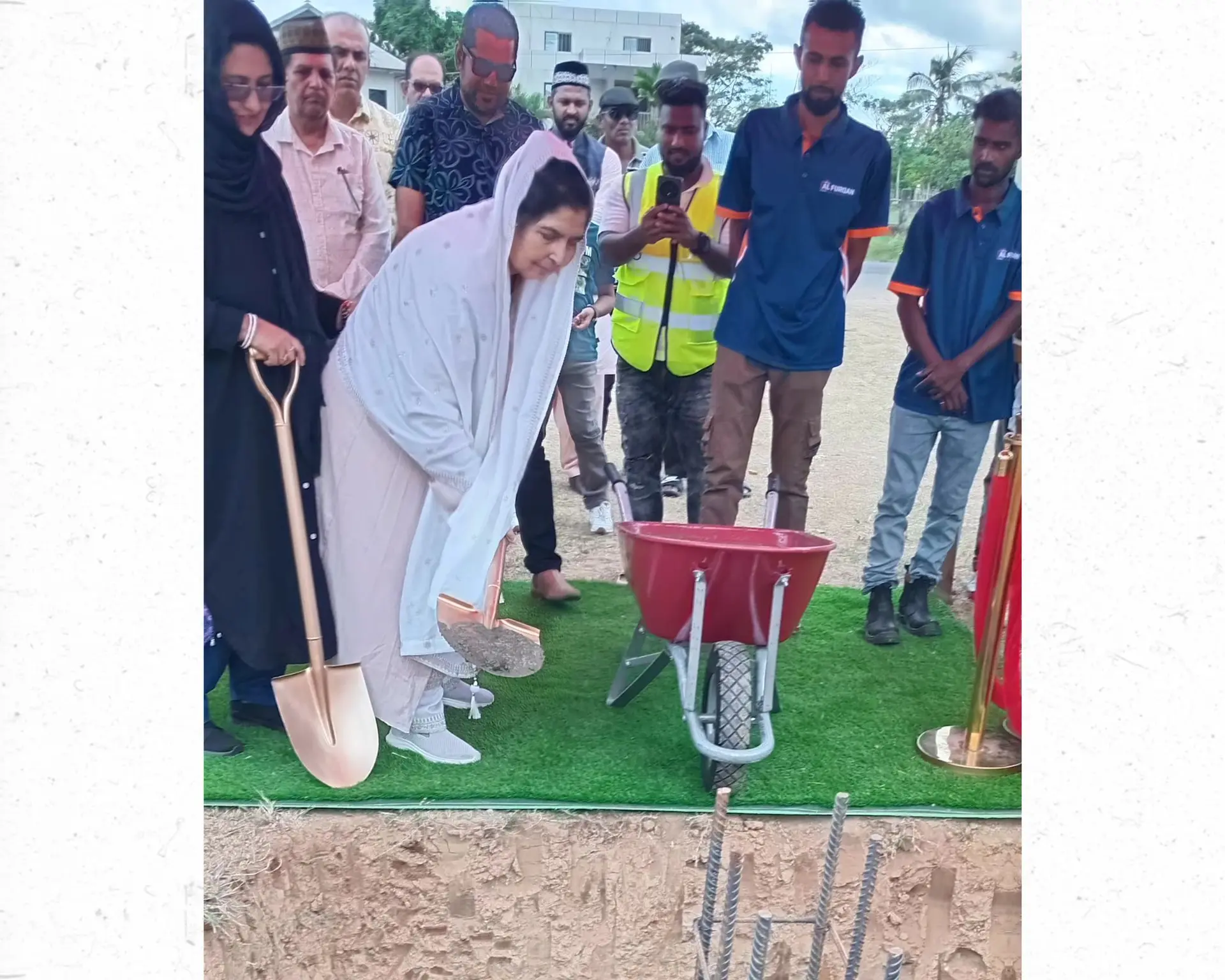 Unifurn Investments Limited director Shamshad Begum pours cement during the foundation-laying ceremony for the new complex.