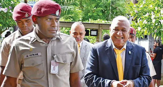 Former Prime Minister Voreqe Bainimarama and former Police Commissioner Sitiveni Qiliho are escorted outside the High Court in Suva on July 16, 2024. Photo: Ronald Kumar