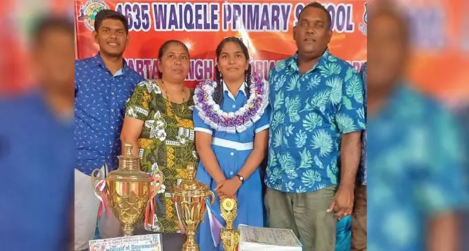 Waiqele Primary School dux Gurneet Kaur with her parents, Ranjit Singh and Asmin Devi, and her brother, Prajeet Singh, during the prize-giving in Labasa on November 28, 2024. 