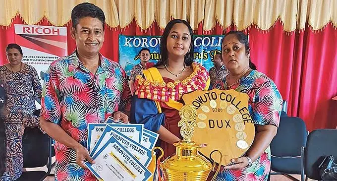 Shreya Nand (middle), with her parents Dewa Nand and Sashi Nand, at Korovuto College, Nadi.