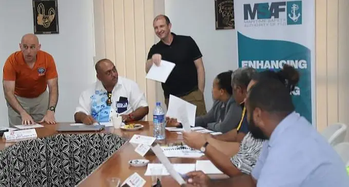 US Coast Guard, Lieutenant-Commander Christopher Schleck (orange) with US Department of Homeland Security International Port Security Liaison Officer Adam Mullins along with Maritime Safety Authority of Fiji (MSAF) officer in charge, Captain Sesoni Komisoso and local participants of the four-day port facility security assessments and ports facility security plans seminar.