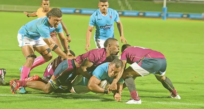 Rising Suva openside flanker Taniela Sadrugu (left) assists his captain James Brown to score their lone try against Lautoka in the Skipper Cup competition at the ANZ Stadium, Suva, on October 23, 2020. Suva won 7-5 to extend their lead on the points table while Lautoka are relegated to next year’s Vodafone Vanua Championship competition.  Photo: Ronald Kumar