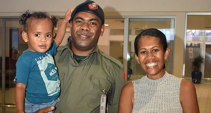 Private Osea Cawi with wife Lusia and daughter Camari at Nadi International Airport on Wednesday night.   Photo: Waisea Nasokia 