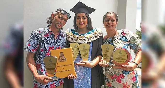 Priyashna Prerna Lal accompanied by her parents Mahendra Lal and Prem Lata with her spoils during the Sangam Institute of Technology College of Nursing and Health Care Education at Civic Centre in Labasa on December 20, 2022. Photo: Shratika Naidu