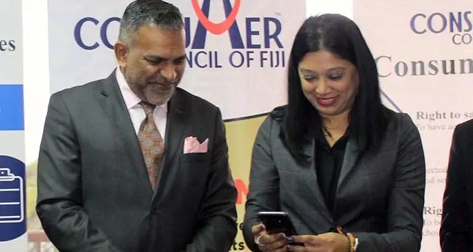 Minister for Commerce, Trade, Tourism and Transport Faiyaz Koya (left), and Consumer Council of Fiji chief executive officer Seema Shandil during the launch of the mobile app at the Consumer Council of Fiji office in Suva on July 24, 2020. Photo: Consumer Council of Fiji