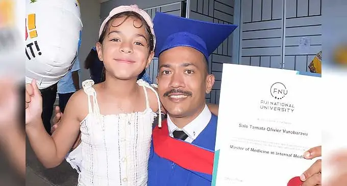 You made it dad...Azaria Vurobaravu congratulates her father, Sale  Vurobaravu following his Fiji National University graduation  ceremony on September 30, 2022. Photo: Ronald Kumar
