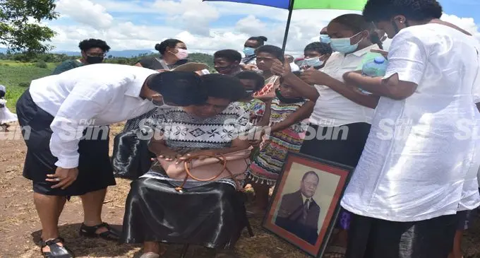 Acting Prime Minister and Attorney-General Aiyaz Sayed-Khaiyum comforting the late Osea Naiqamu's wife, Ulukalisi Bale Naiqamu at Nawaicoba in Nadi. Photo: Mereleki Nai
