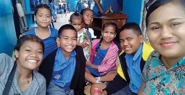 Salote Tikoibua (far right), Michael Trinity Tikoibua (yellow jacket) with her nieces and nephews at Holy Family Primary School on June 6, 2023.