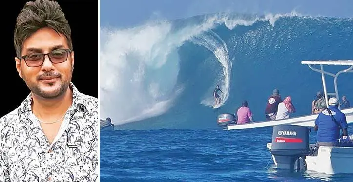 Surfing at Cloudbreak, off Tavarua, in the Mamanucas with the real estate agent, Simon Naushad.
