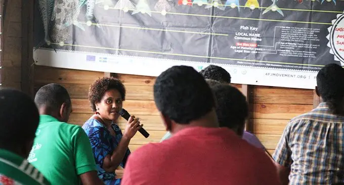 Fiji Locally Managed Marine Area Network (FLMMA) project officer Peniana Wainua speaking with Fulaga villagers on March 17, 2022. Photo: Kelera Sovasiga
