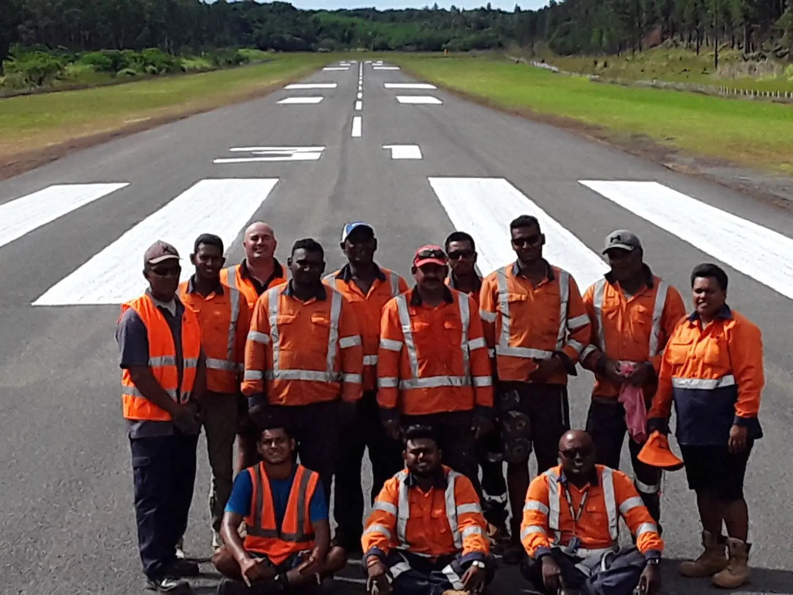 Staff after completing the runway upgrade in Lakeba.
