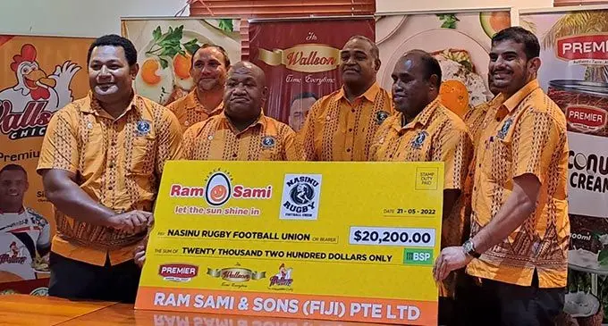 Ram Sami & Sons business development manager Abdul Shameer ( right) with Nasinu Rugby Union administrators on May 31, 2022. Photo: Sereana Salalo