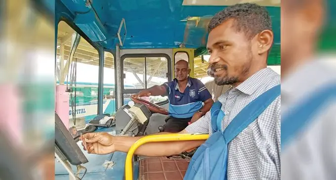 A commuter pays for his fare as he boards the bus at the Suva Bus Terminal on August 1, 2023. Photo: Ronald Kumar
