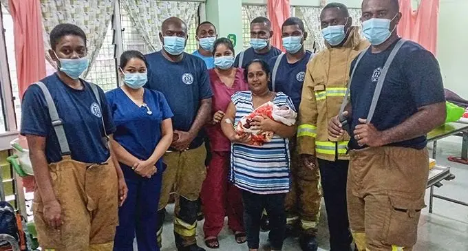 Sristi Naicker and her newborn daughter with medical staff and National Fire Authority officers at the Rakiraki Hospital on January 9, 2022. Photo: National Fire Authority