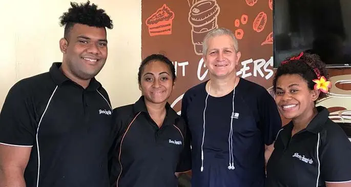 British Deputy High Commissioner to Fiji Paul Welsh (third from left) dropped in at Gloria Jean’s after his morning run yesterday for coffee and croissants, where he was asked by staff for a group photo.