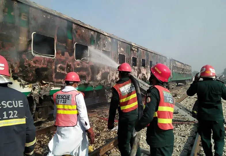  Rescuers working after a passenger train caught fire in Rahim Yar Khan district of Pakistan's east Punjab province on Oct. 31, 2019. 