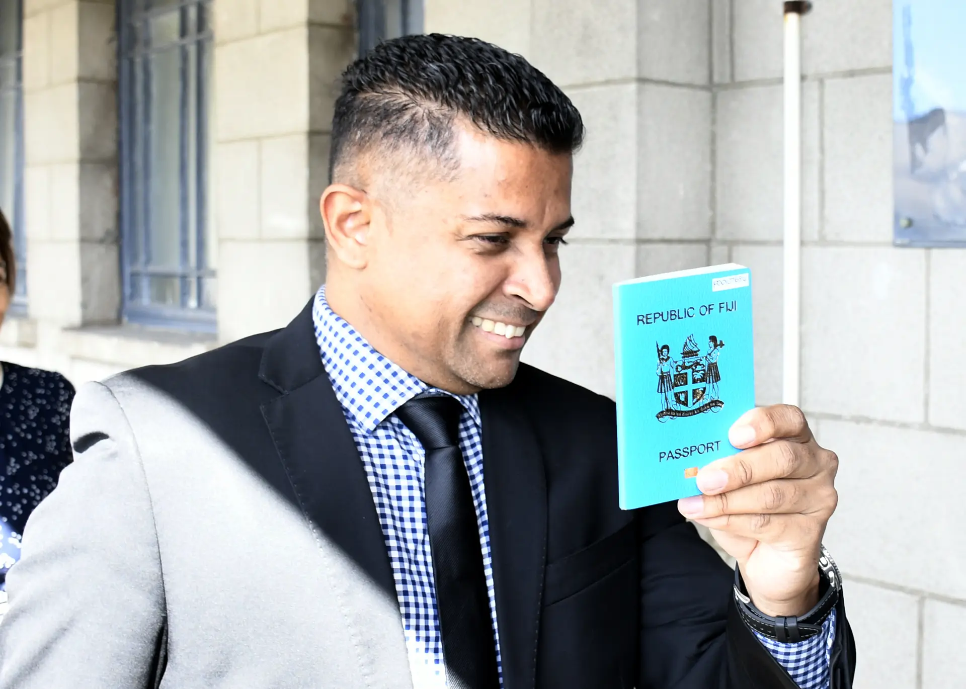 Former Supervior of Election Mohammad Saneem with his passport outside High Court on July 1, 2026. 