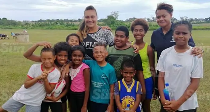 Fiji Airways Fijiana XV reps Leilaini Burness and Torika Semo with members of the Jetset Junior Rugby Club at Namaka, Nadi on June 27,2020. Photo: Waisea Nasokia