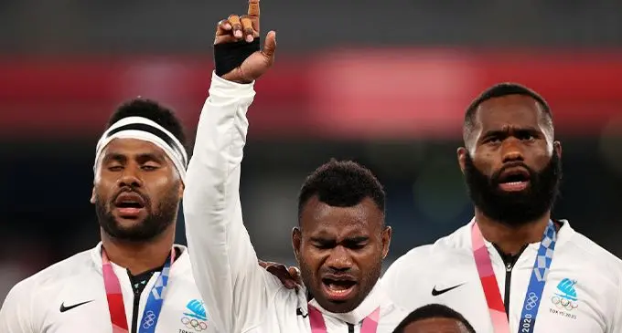 Jerry Tuwai (middle) with Vilimoni Botitu (left) and Semi Radradra on the gold medal podium of the Tokyo 2020 Olympic Games in Japan.  