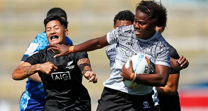 Inspirational Fiji Airways Fijiana 7s captain Raijeli Daveua pushes off a New Zealand player on her way to score one of their three tries in their final pool game of the New Zealand Sevens in Hamilton, New Zealand on January 26, 2020. Daveua and Asinate Savu are back in the country after they got injured in Hamilton. Photos: World Rugby