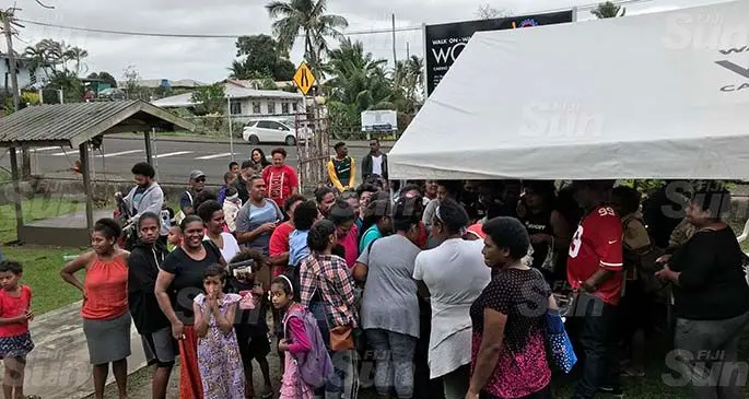 Members of the public arriving to the WOWS Market Day in Rewa St, Suva.