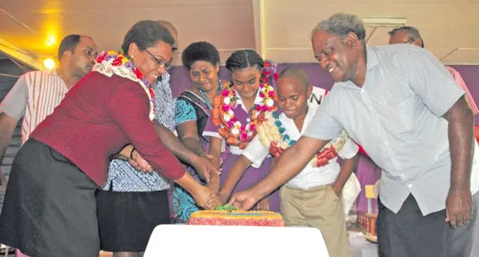 From left , the Minister for Women, Children and Poverty Alleviation ,Mereseini Vuniwaqa cuts the cake with officials of Sigatoka Methodist Primary School after the school's induction ceremony in Sigatoka on 9 February 2018. Photo: Arieta Vakasukawaqa