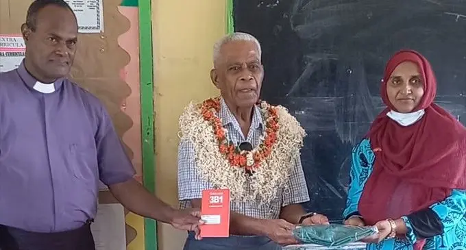 Reverend Kalivati Tuitoga, Tui Ba Ratu Vilimoni Lagivala hands-over the package to head teacher Jubina Ali at the school, in Lutunairi, Sorokoba, Ba on January 16, 2023. Photo: Waisea Nasokia
