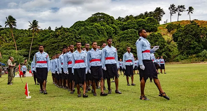 Colonel Litea Seruiratu salutes a student at the Napuka Secondary School passing-out parade in Cakaudrove on August 7, 2019.  Photo: United States Army